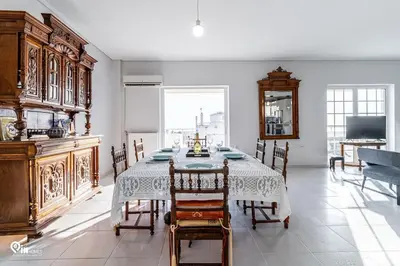 a dining room with a table and chairs at Hliana - Premium Sky & Sunset View House in Glyfada in Athens