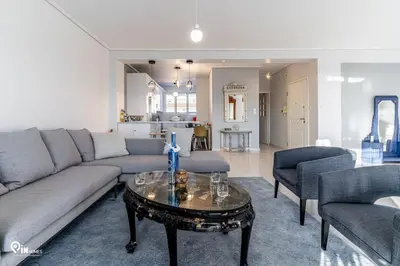 a living room with a couch and a table at Hliana - Premium Sky & Sunset View House in Glyfada in Athens