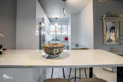 a kitchen with a counter with a bowl on it at Hliana - Premium Sky & Sunset View House in Glyfada in Athens