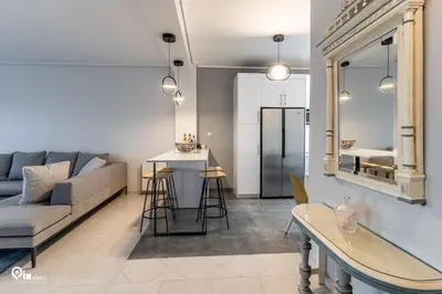 a living room with a couch and a table at Hliana - Premium Sky & Sunset View House in Glyfada in Athens