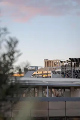a view of a train station with a train on at Athens Golden Light Premium Residence in Athens