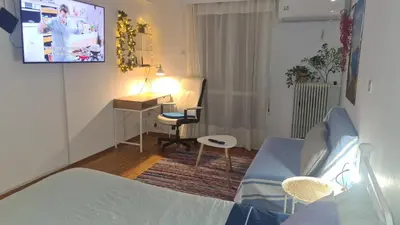 a room with a bed and a desk and a chair at Galatsi Studio Apartment -Attica in Athens