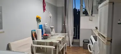 a kitchen with a table with a vase on it at Galatsi Studio Apartment -Attica in Athens