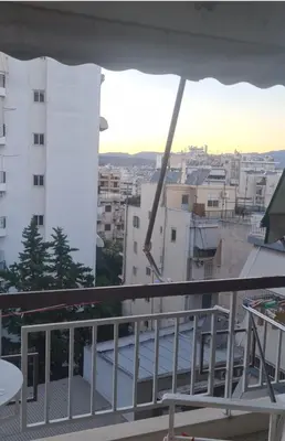 a balcony with a view of a city at Galatsi Studio Apartment -Attica in Athens