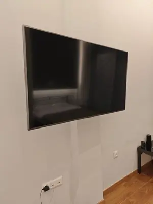 a flat screen tv hanging on a wall at Bonas House in Athens