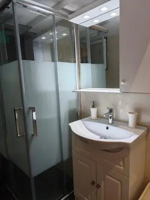 a bathroom with a sink and a shower at Bonas House in Athens