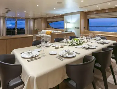a dining room with a table in a yacht at Luxury Yacht RINI V in Athens