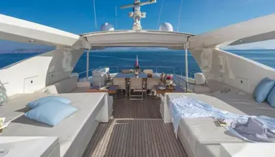 a boat with two beds and a table on it at Luxury Yacht RINI V in Athens