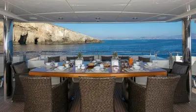 a table on a boat with a view of the ocean at Luxury Yacht RINI V in Athens