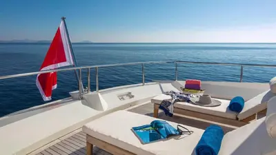 a boat with a table and chairs on the deck at Luxury Yacht RINI V in Athens