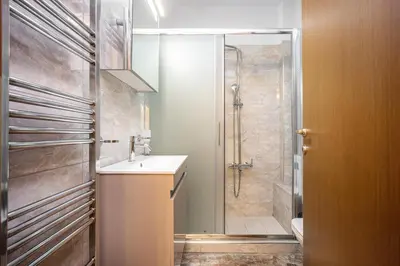 a bathroom with a shower and a sink and a toilet at Athens Homster in Athens