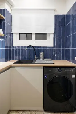 a kitchen with a sink and a dishwasher at Cozy Apartment in Larisis 9-11 in Athens