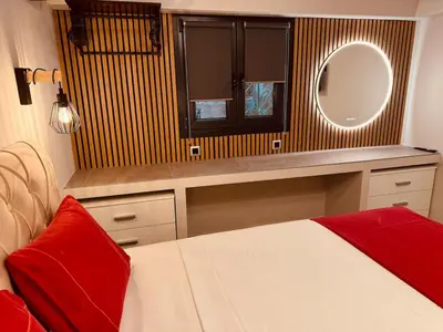 a bedroom with a bed and a vanity with a mirror at Loft Athens 2 - 55m2 in Athens