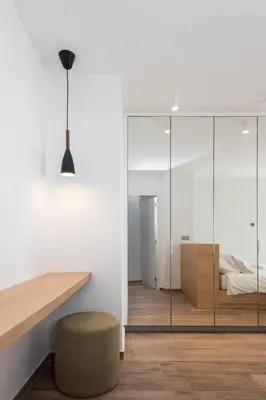 a room with a glass partition with a bed and a stool at Zeus3 Beach Front Appartment, 2 BR, Sea View in Athens