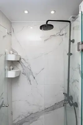 a bathroom with a shower with a glass door at Zeus3 Beach Front Appartment, 2 BR, Sea View in Athens