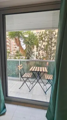 a view of a balcony with a table and chairs at Inspire Apartment Palaio Faliro in Athens