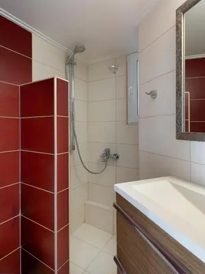 a bathroom with a shower and a sink at Kolonaki Suite with Panoramic View in Athens