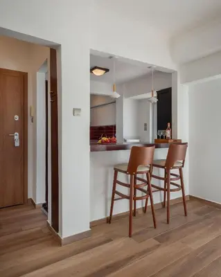 a kitchen and dining room with a table and chairs at Kolonaki Suite with Panoramic View in Athens