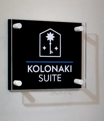 a black and white sign on a wall with kokolniki suite at Kolonaki Suite with Panoramic View in Athens