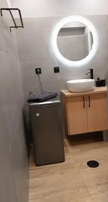 a bathroom with a sink and a mirror at Rock Garden in Athens