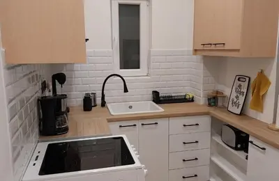 a small kitchen with a sink and a counter at Rock Garden in Athens