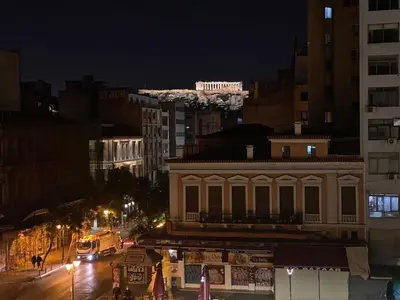 a building on a city street at night at Apartment At Historic Center of Athens in Athens