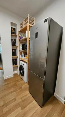 a kitchen with a stainless steel refrigerator in a room at Heart of Faliro 2BR 5m Walk to Beach - Newly Renovated in Athens