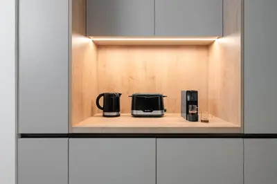 two coffee makers sitting on a shelf in a kitchen at Leocharous 8 Suites in Athens