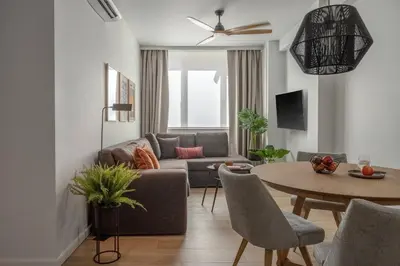 a living room with a couch and a table at Leocharous 8 Suites in Athens