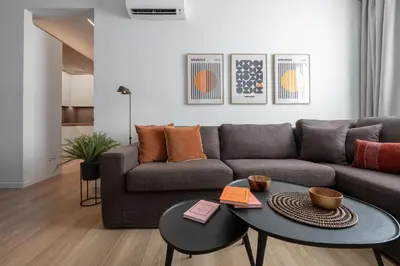 a living room with a couch and a table at Leocharous 8 Suites in Athens