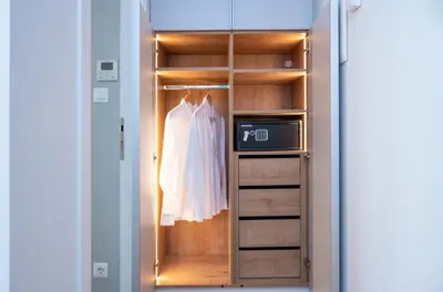 a closet with a white dress hanging in it at Leocharous 8 Suites in Athens