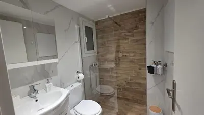 a white bathroom with a sink and a toilet at Central Lux Lining B in Athens