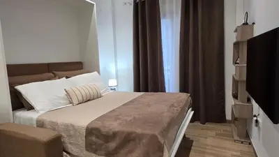 a small bedroom with a bed and a television at Central Lux Lining B in Athens