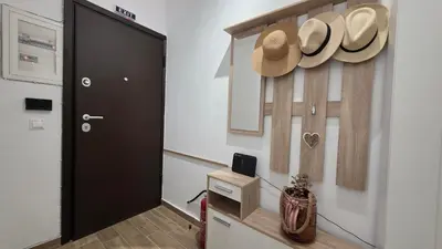 a room with a door and hats on the wall at Central Lux Lining B in Athens