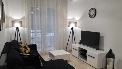 a living room with a couch and a flat screen tv at Central Lux Lining A in Athens