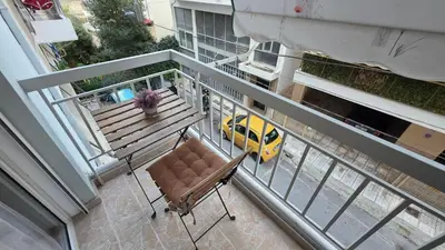 an overhead view of a balcony with a bench and a yellow car at Central Lux Lining A in Athens