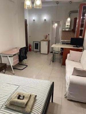 a living room with a couch and a table at Μοντέρνος χώρος στο κέντρο της πόλης in Athens