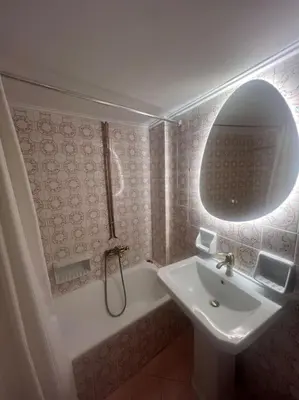 a bathroom with a sink and a bath tub at Urban nest in Athens