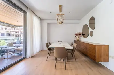 a dining room with a table and chairs at Glyfada Gem - 3BD apartment in Athens
