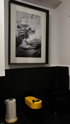 a picture hanging on a wall with a picture on it at Fos Apartment - Ippokratous 2BDR Central Flat in Athens