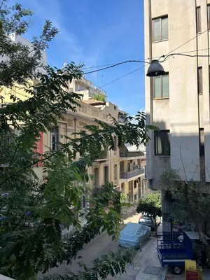 a view of a city street with tall buildings at Fos Apartment - Ippokratous 2BDR Central Flat in Athens