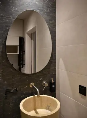 a bathroom with a sink and a mirror at Fos Apartment - Ippokratous 2BDR Central Flat in Athens
