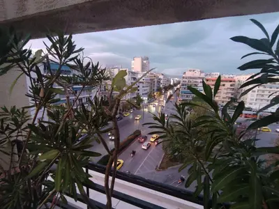 a view of a city street from a window at Park View Penthouse in Athens