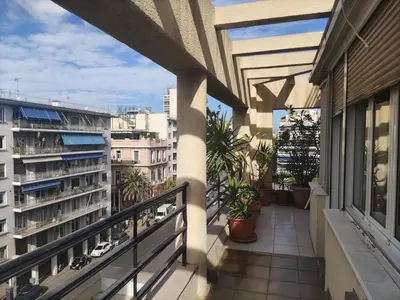 a balcony with a view of a building at Park View Penthouse in Athens