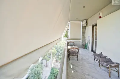 a balcony with a table and chairs in a house at Afrodite Classic Residence, 2BR, WiFi, City View in Athens