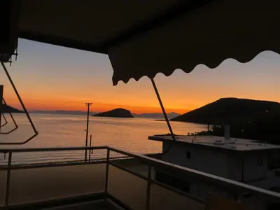 a view of the sunset from the deck of a boat at Nenas house in Porto Rafti