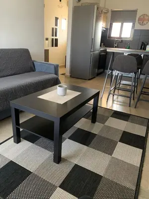 a living room with a couch and a coffee table at Nenas house in Porto Rafti