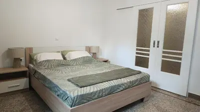 a bedroom with a bed and a door to a closet at Edem apartments in Athens