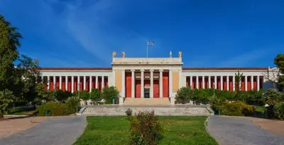 a large building with red and white columns at Edem apartments in Athens