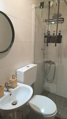 a bathroom with a toilet and a sink and a shower at Edem apartments in Athens